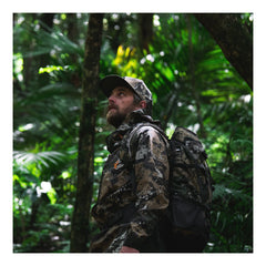 Desolve Veil Camo | Halo Jacket On Hunter Model in Forest. 