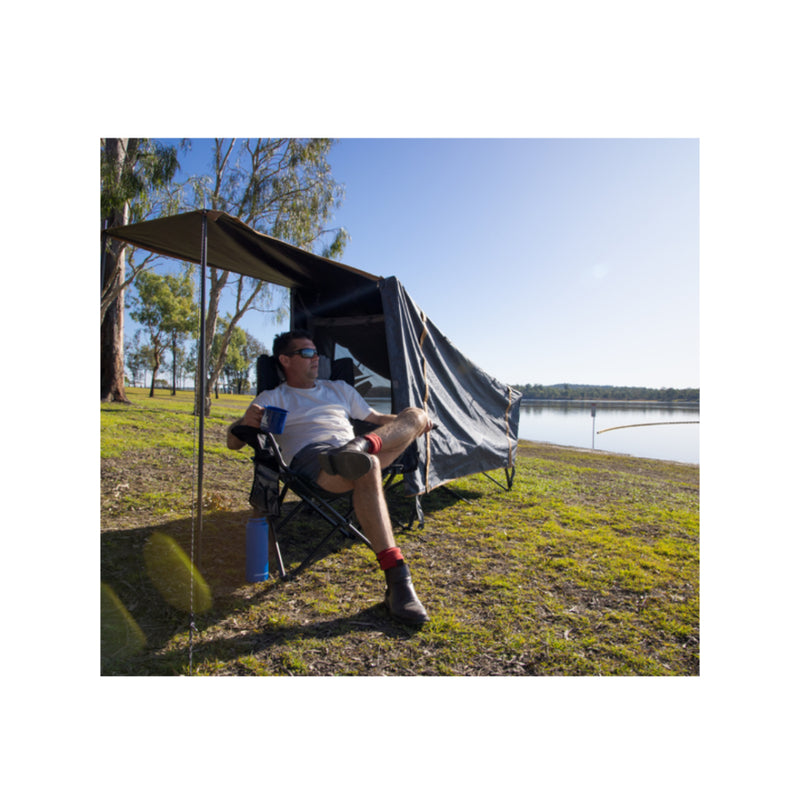 Black | Oztrail Blockout Easy Fold Stretcher Tent - Single. Shown In Use By The Lake. 
