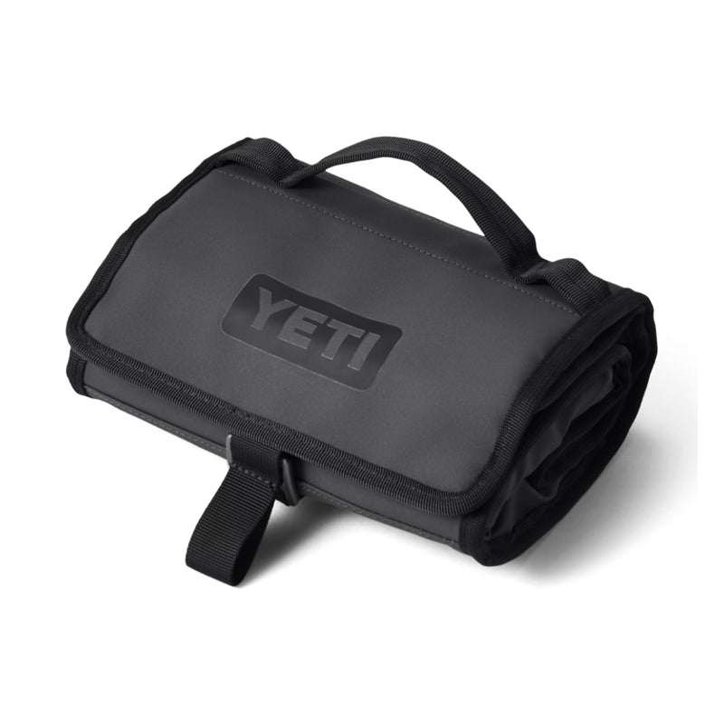 Charcoal | YETI Daytrip Lunch Bag Soft Cooler. Shown Rolled Up Empty.