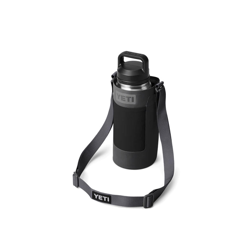 Charcoal | YETI Rambler Bottle Sling Large Image Showing A Bottle In Sling With Strap Down In Front Displaying YETI Logos.