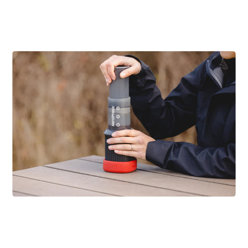 Grey | Aeropress Go Travel Coffee Press Image Showing Coffee Being Pressed.
