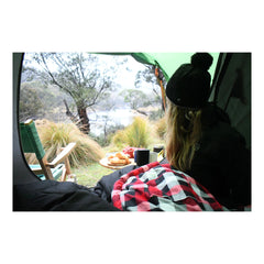 Black | Black Wolf Bushranger All Seasons Sleeping Bag Shown In Use While Camping.  