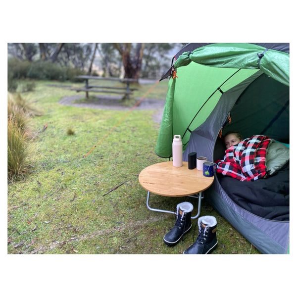 Black | Black Wolf Bushranger All Seasons Sleeping Bag Shown In Use While Camping.  
