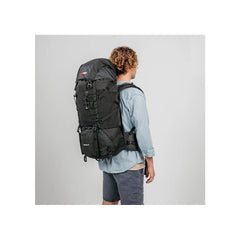 Black/60L | Black Wolf Nakeen 60L Hiking Pack Image Showing Angled Back View On A Model.