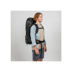 Black/60L | Black Wolf Nakeen 60L Hiking pack Image Showing Angled Side View On A Model.