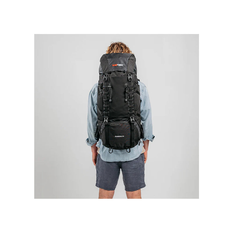 Black/60L | Black Wolf Nakeen 60L Hiking Pack Image Showing Back View On A Model.