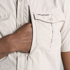 Parchment | Close up of zippered security chest pocket.