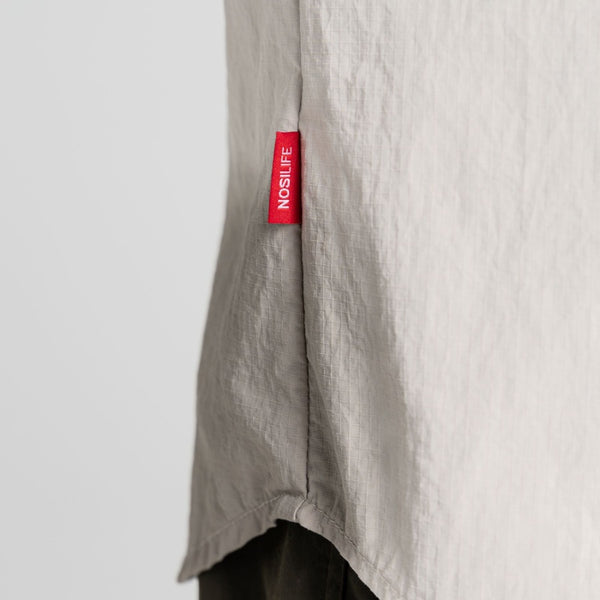 Parchment | Close up of side seem with red NOSILFE tag.