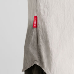 Parchment | Close up of side seem with red NOSILFE tag.