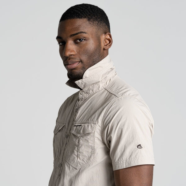Parchment | Side view of shoulders with collar up.