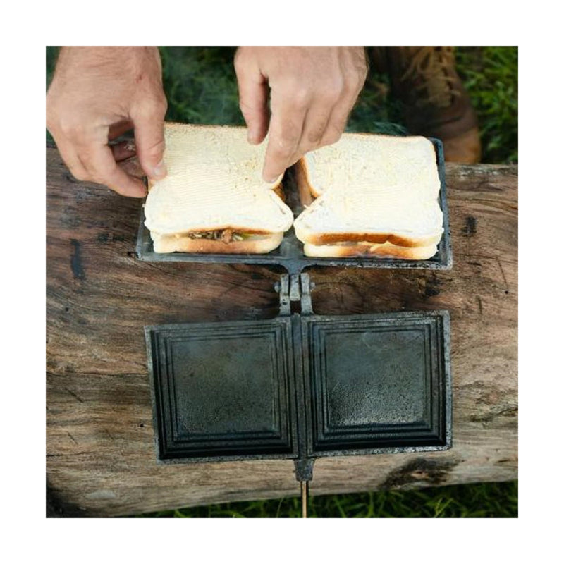 Black / Double | Campfire Double Jumbo Jaffle Iron Image Showing Top View Of Two Sandwiches Being Placed Into The Jaffle Iron.