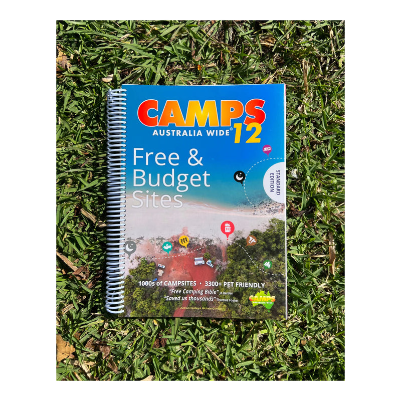 Camps Australia Wide Standard Edition 12 | Image Showing Spiral Bound Book On The Grass In The Sun.