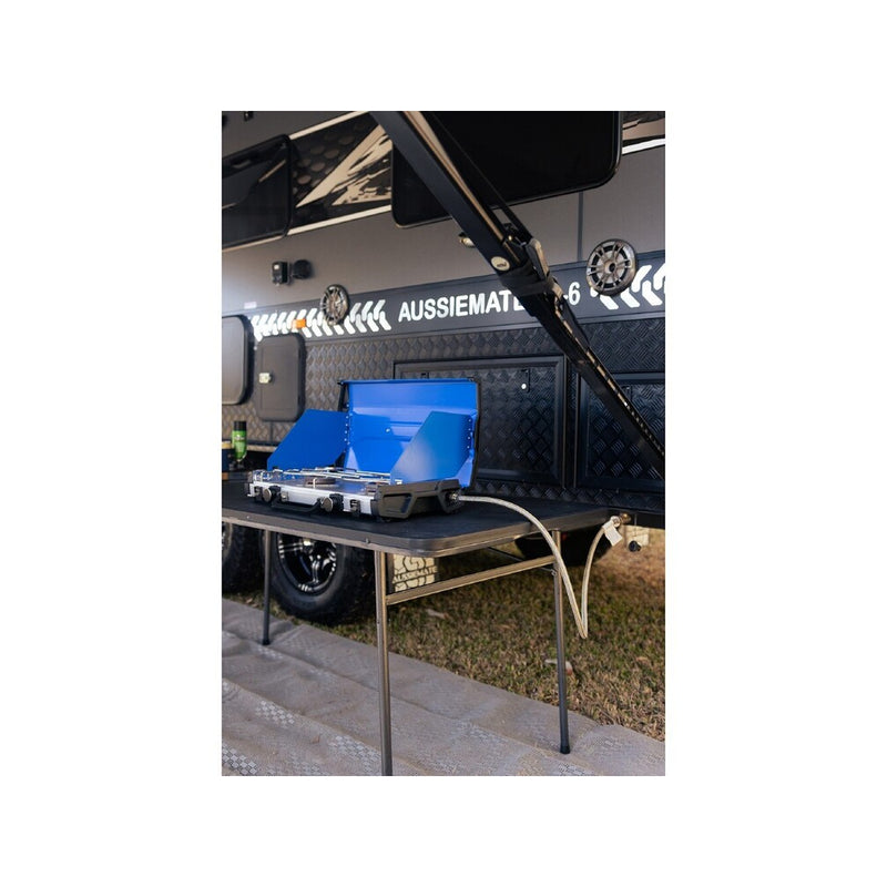 Blue | Companion Proheat Low Pressure 2 Burner With FSD Image Showing Angled View Of Stove Set Up To A Camper Van.