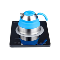 Single/Black | Companion Roam Induction Cooktop Image Showing The Silicone Mate And A Kettle On The Cooktop.