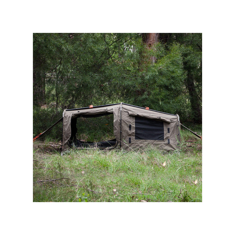 1400 / Khaki | Darche Dirty Dee Swag With 70mm Mattress Image Showing Side Very Of The Swag Set Up On A Camp Ground.