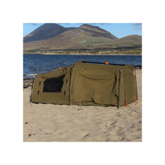 1400 / Khaki | Darche Dirty Dee Swag With 70mm Mattress Image Showing The Swag Set Up At The Beach.