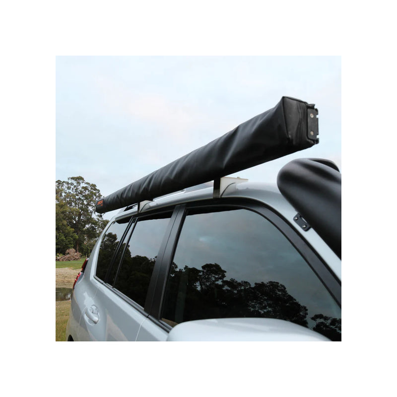 2.5m x 2.5m | Darche Eclipse Slimline Awning Image Showing Angled View Of The Awning Packed Up, On A Car.