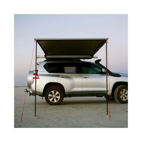 2.5m x 2.5m | Darche Eclipse Slimline Awning Image Showing Front View Of Awning Set Up On A Beach.