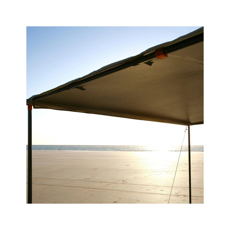 2.5m x 2.5m | Darche Eclipse Slimline Awning Image Showing Bottom, Under-Side View Of Awning Set Up On A Beach.