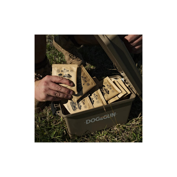 48 Pack | Dog& Gun Mixed Roast Reload Pack Image Showing Top View Of The Case With Coffee Being Taken Out.