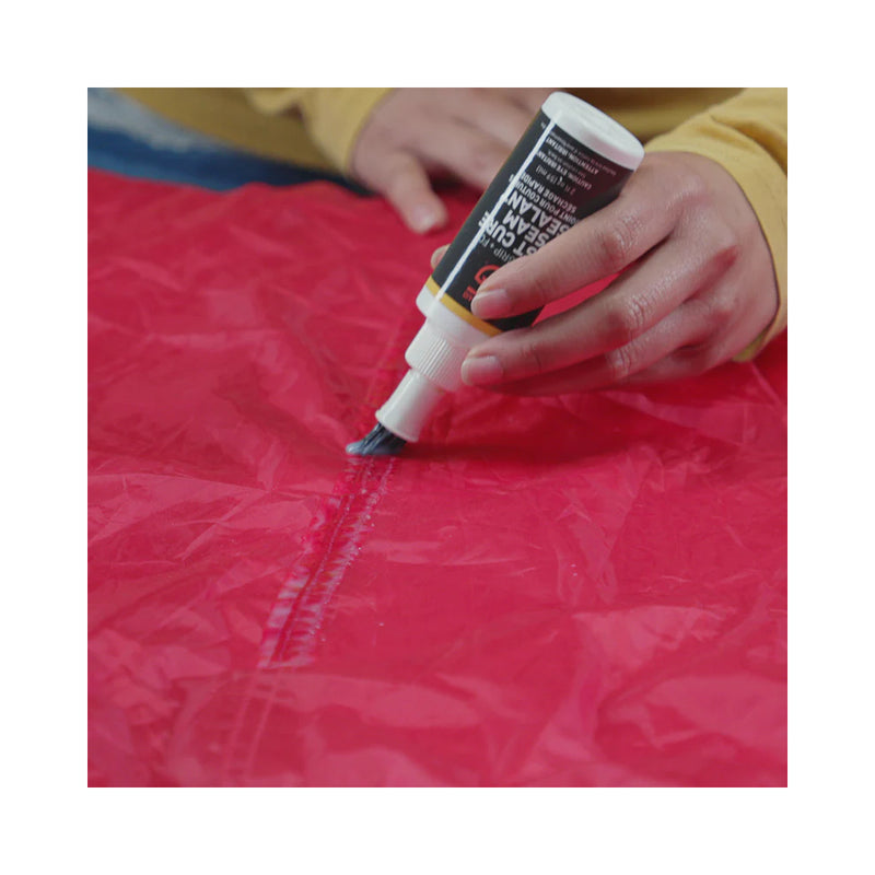 Gear Aid Seam Grip + FC Tent Sealant |  Image Showing Sealant Being Applied.