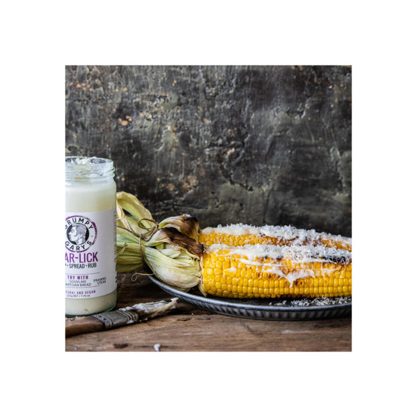 220g | Grumpy Gary's Gar-Lick Dip Spread Rub Image Showing  The Spread On Top Of Some Corn.