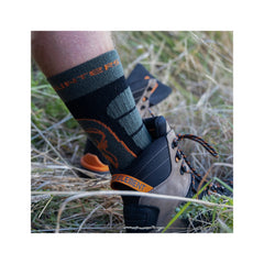 Forest Green | Hunters Element Apex Sock Image Showing Cuff Of Sock On The Calf Of a Model While Wearing Boots.