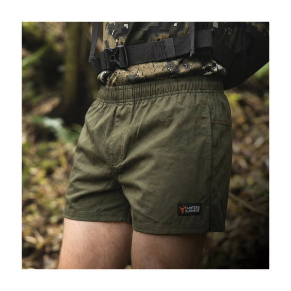 Forest Green | Hunters Element Mainstay Stubbies Image Showing The Stubbies Being Worn Out In The Bush.