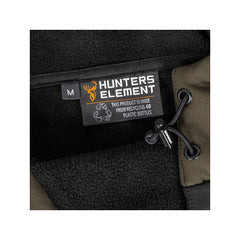 Black/Forest Green | Hunters Element Tusk Bush Coat Image Showing Close Up View Of The Tag.