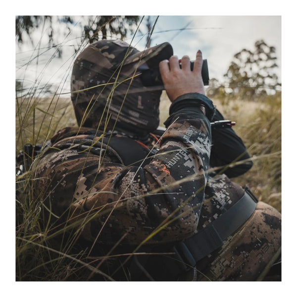 Desolve Veil Camo | Shown on Hunter Model Lying In Grass. 