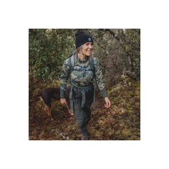 Black/Grey | Hunters Element Womens Boulder Trouser Image Showing Model Wearing Trouser In The Bush.