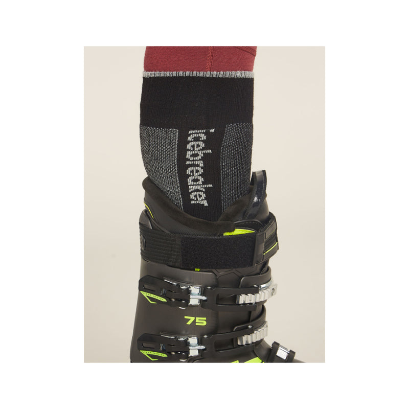 Black/Grey | Icebreaker Men's Merino Ski + Men's Medium Over The Calf Socks Image Showing Sock Inside Ski Boot.