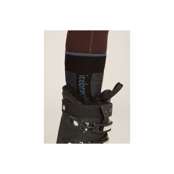 Black/Blue | Icebreaker Women's Merino Ski + Medium Over The Calf Socks Image Showing , Sock Inside A Ski Boot.
