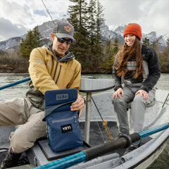 Navy / 6L | YETI Daytrip Insulated Lunch Bag Image Showing Lunch Bag Being Used On A Boat.