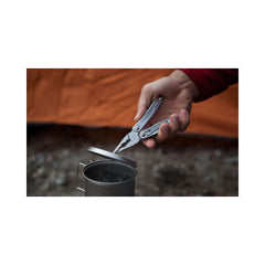 Leatherman Sidekick | Image Showing Pliers Being Used To Remove A Hot Lid Off Of A Can While Camping.