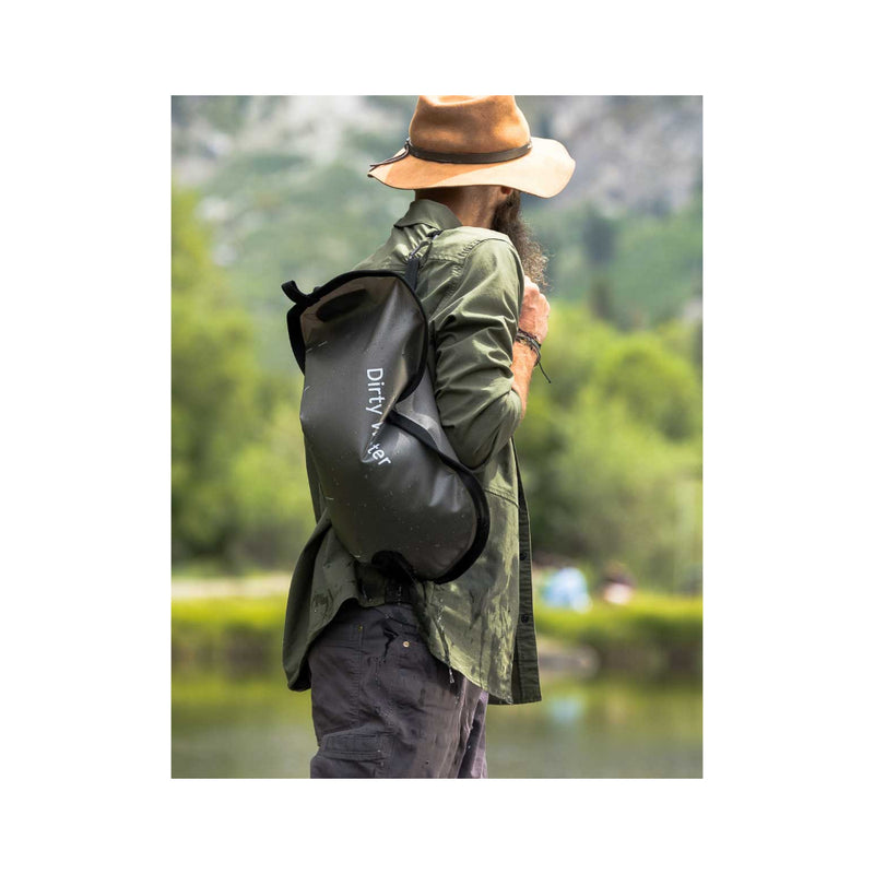 Mountain Blue/8L | LifeStraw Peak Series Gravity Water Filter System Image Showing The Water Filter System Being Carried To Camp After Being Filled.
