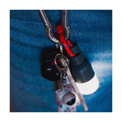 Luci Solar Anywhere Site Lights | Image Showing Bulb Attached To A Set Of Keys, Lights On.