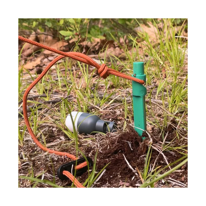 Luci Solar Anywhere Site Lights | Image Showing Stake In Ground With Guy Rope On, Bulb Off.