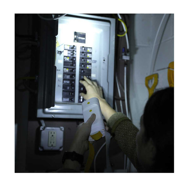 Luci-Solar HeadLamp And FlashLight | Image Showing FlashLight Being Used To Locate Fuses.