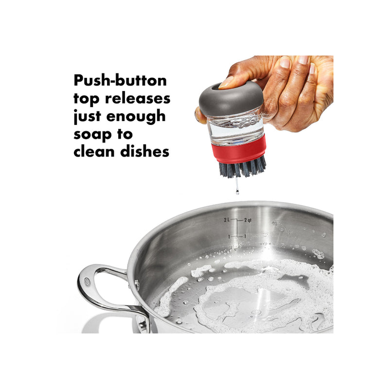 OXO Outdoor Soap Dispensing Brush With Storage Case | Image Showing How To Dispense The Soap.