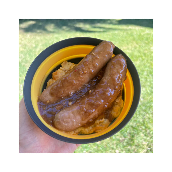 250g | On Track Aussie Pork Snags Image Showing A Serving Suggestion.