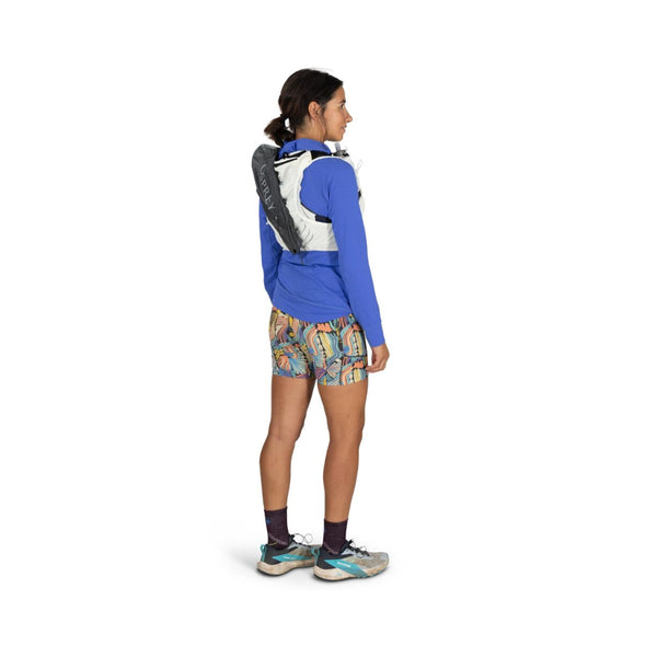 Mystery White | Osprey Duro Pro 10L Womens Hydration Vest With Flasks  Image Showing A Model Wearing The Osprey Duro Pro 10L Womens Hydration Vest With Flasks Angled Back View.