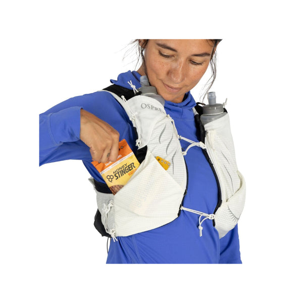 Mystery White | Osprey Duro Pro 10L Womens Hydration Vest With Flasks Image Showing The Osprey Duro Pro 10L Womens Hydration Vest With Flasks  On A Model, Angled Front View, Close Up Side Pocket.