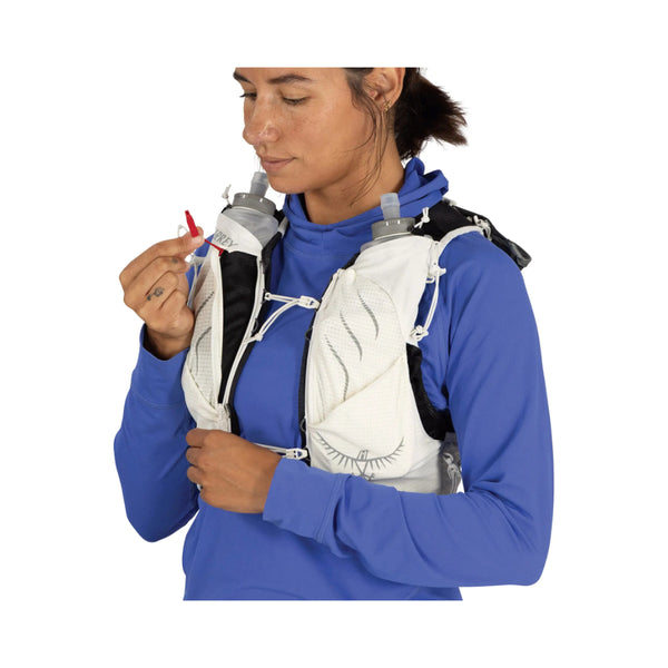 Mystery White | Osprey Duro Pro 10L Womens Hydration Vest With Flasks Image Showing The Osprey Duro Pro 10L Womens Hydration Vest With Flasks  On A Model Image Showing Angled Front View, With Safety Whistle Out.