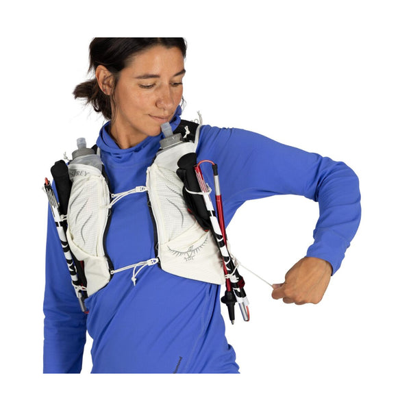 Mystery White | Osprey Duro Pro 10L Womens Hydration Vest With Flasks Image Showing The Osprey Duro Pro 10L Womens Hydration Vest With Flasks  On A Model Image Showing Walking Pole Strapped To The Front Of The Vest.