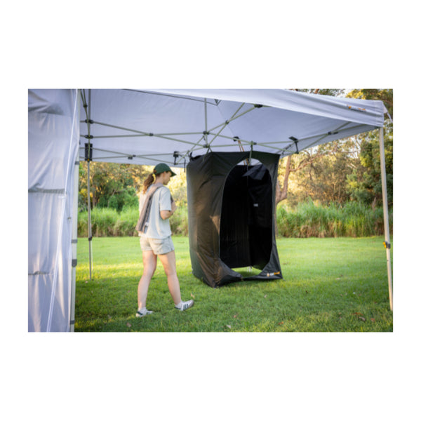 Black | Oztrail Deluxe Gazebo Blockout Ensuite Image Showing Angled Front View, Door Open, Set Up At Camp.