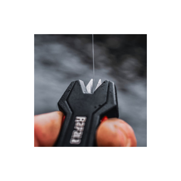 Black |  Rapala RDC Retractable Line Scissors Image Showing Close Up Of The Line Being Cut.