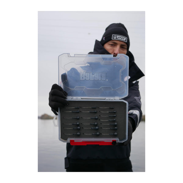 3600 / Smoke Grey | Rapala Rapstack Open Foam Tackle Box Image Showing A Model Showing The Inside Of The Tackle Box Being Used To Hold Hooks, Lid Open.