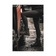 Ridgeline Women's Infinity Leggings | Dark Olive Image Showing Leggings Being Worn In Wet And Muddy Conditions.