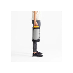 High Rise / 13L | Sea To Summit Evac Ultra-Light Compression Dry Bag Image Showing A Male Model Carrying The Dry Bag.